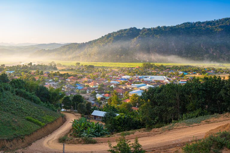 Muang Long village in the golden triangle, Luang Namtha North Laos near China Burma Thailand, small town in river valley with scenic mist and fog